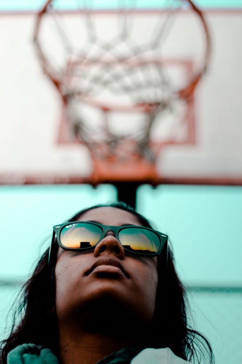 person wearing black ray ban wayfarer sunglasses with black frames in worms eyeview photography during daytime