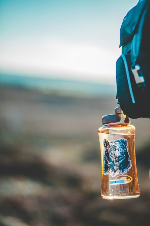 selective focus photo of brown plastic bottle BYNn