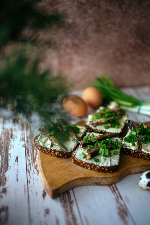 brown wooden round tray with green leaves