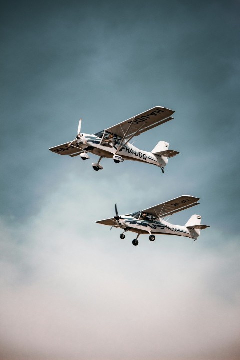 two airplanes flying in the sky