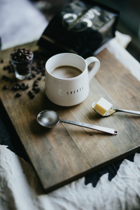 cup of coffee on brown wooden tray 6m