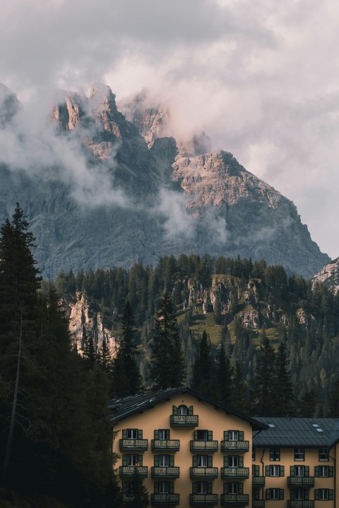 a building with a mountain in the background