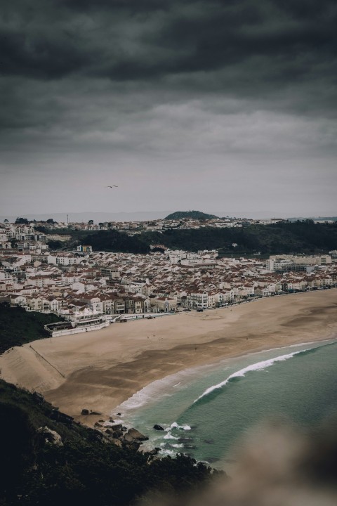 birds eye photography of building structures near body of water No4Mm