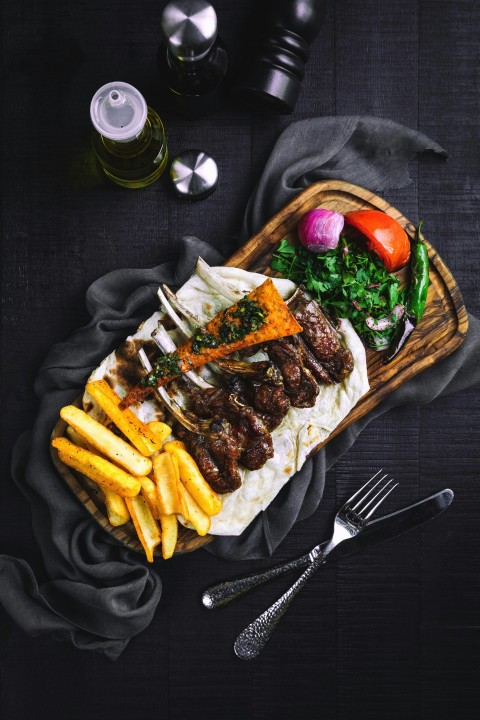 fries and meat on brown woven tray