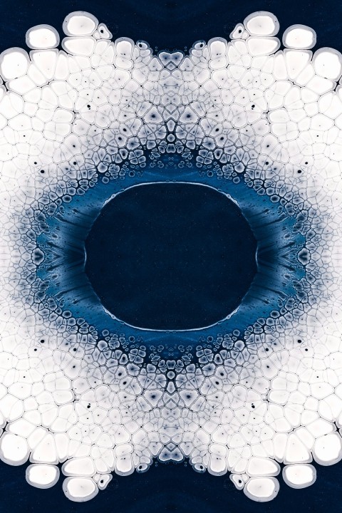 a blue and white circular design with bubbles