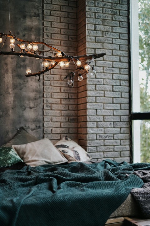 black and white textile near brown brick wall G