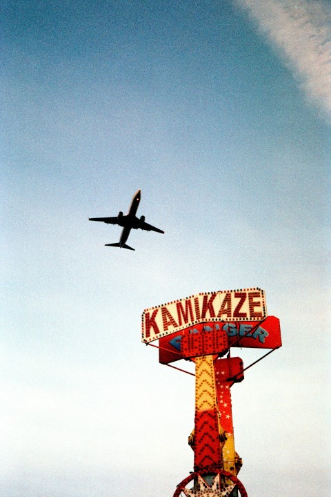 a large jetliner flying through a blue sky