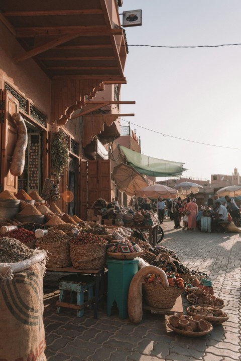 people in market selling goods during daytime