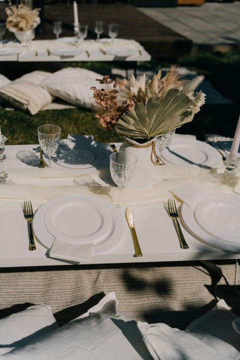 a table set with plates and glasses