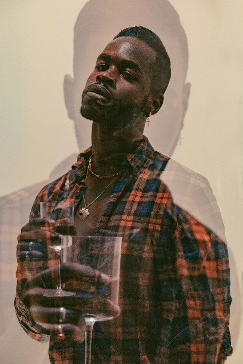 man in red white and black plaid button up shirt