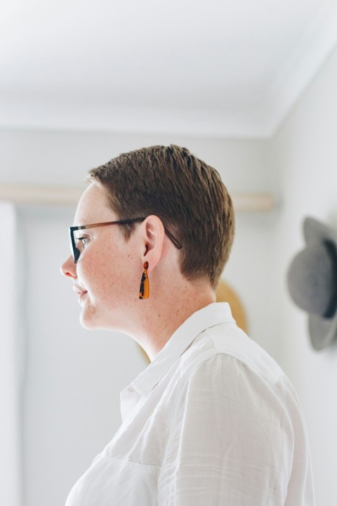 man in white shirt wearing black framed eyeglasses