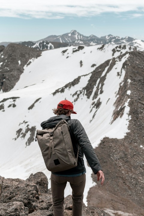 man carrying backpack