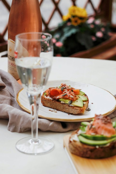 bread with tomato and lettuce on white ceramic plate