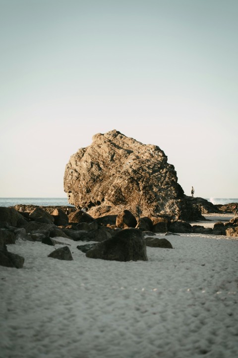 brown rock formation on sea shore during daytime