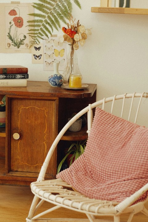 a chair with a blanket on it in a room