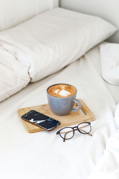 white ceramic mug on brown wooden tray xxRUmt