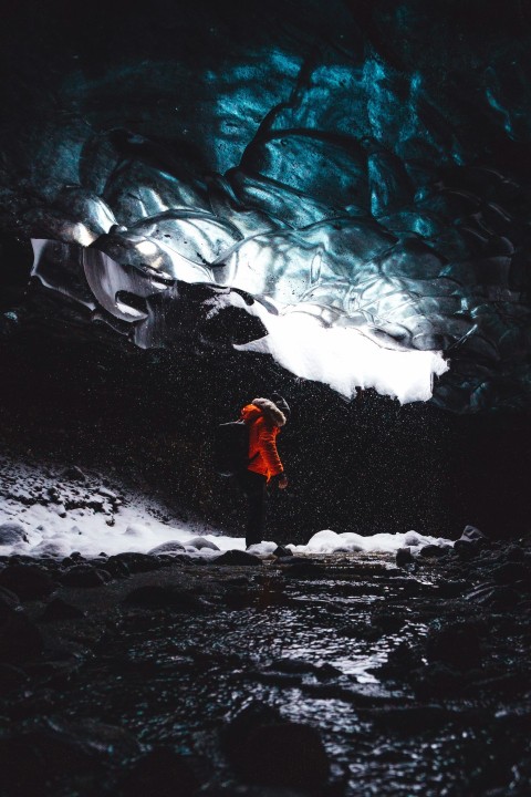 person standing inside the cave Q37XPjo