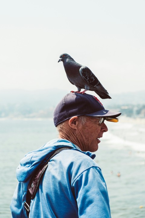 a man with a bird on his shoulders