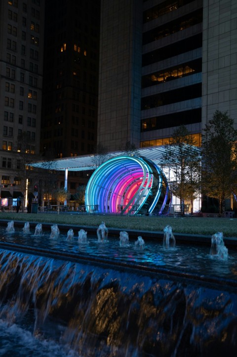 water fountain in the middle of the city during night time