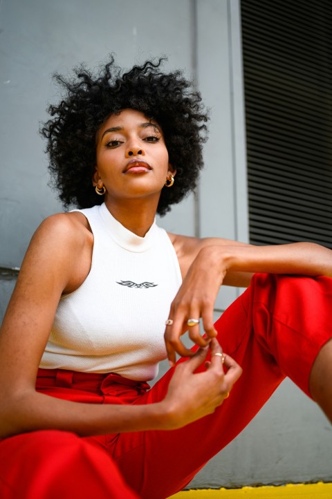 woman in white tank top and red skirt dBwrTc