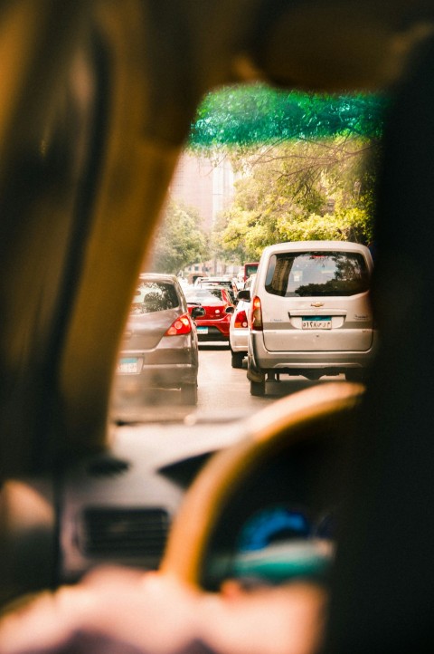 vehicles on road during daytime