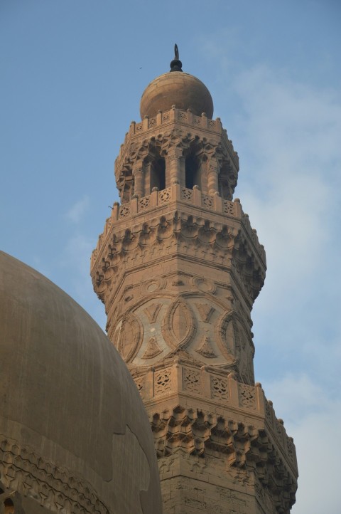 a tall tower with a domed roof