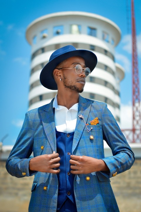 a man wearing a hat and glasses