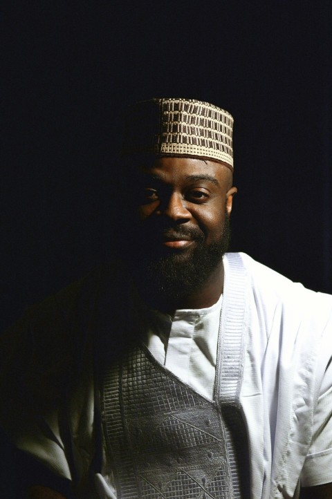 a man in a white shirt and a hat