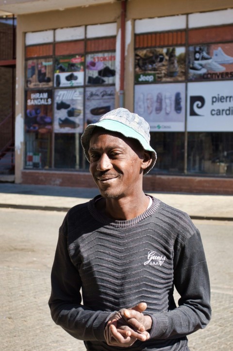 man wearing black sweater and grey hat