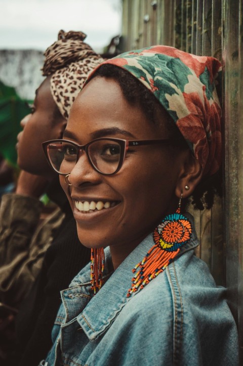 a woman wearing glasses and a head scarf 73ORg