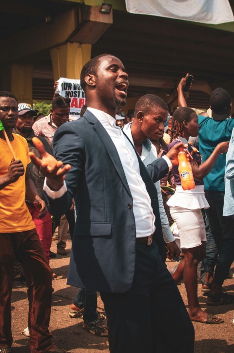 a person in a suit dancing with a person in a suit