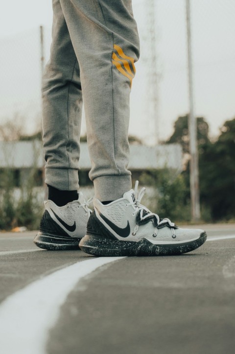 a close up of a persons shoes on the ground