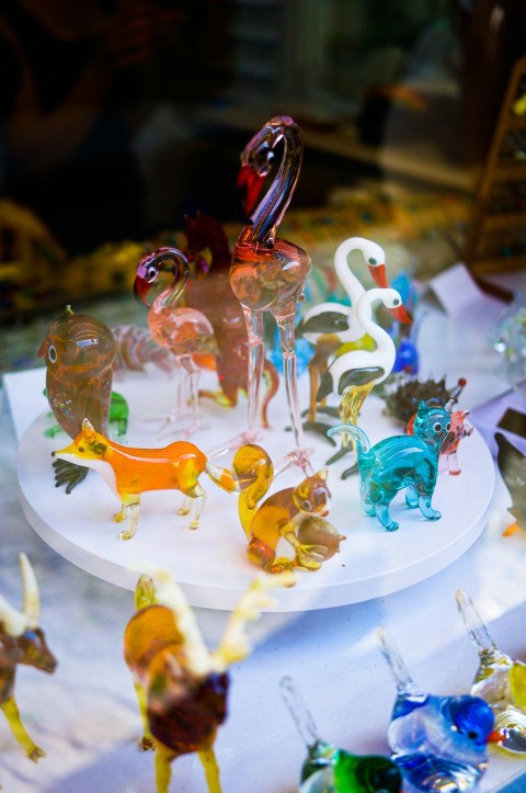 a display of glass animals on a table