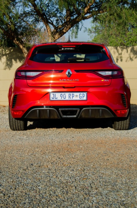 red car on brown dirt