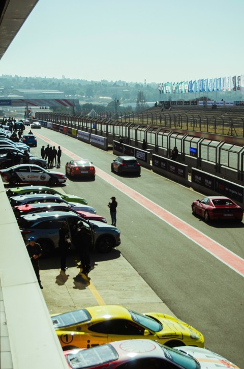 a parking lot filled with lots of parked cars