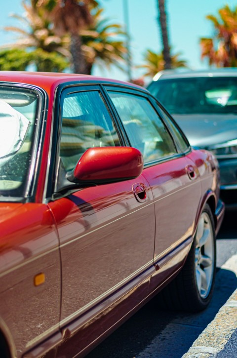 a red car parked on the side of the road