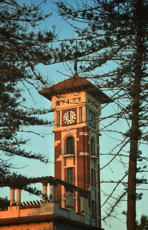 a tall clock tower with a clock on each of its sides