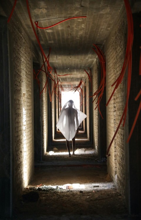 person walking on hallway inside building