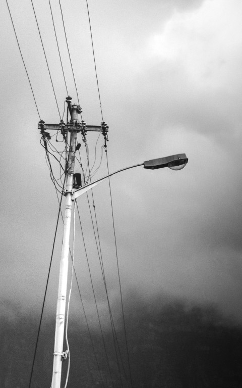 a black and white photo of power lines and wires