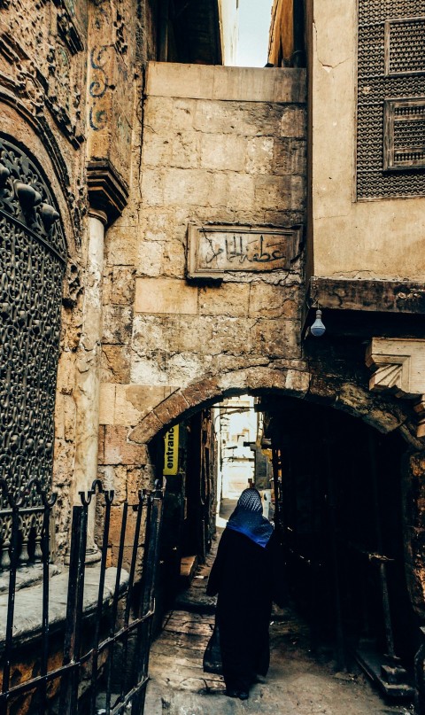 woman walking on arch pathway