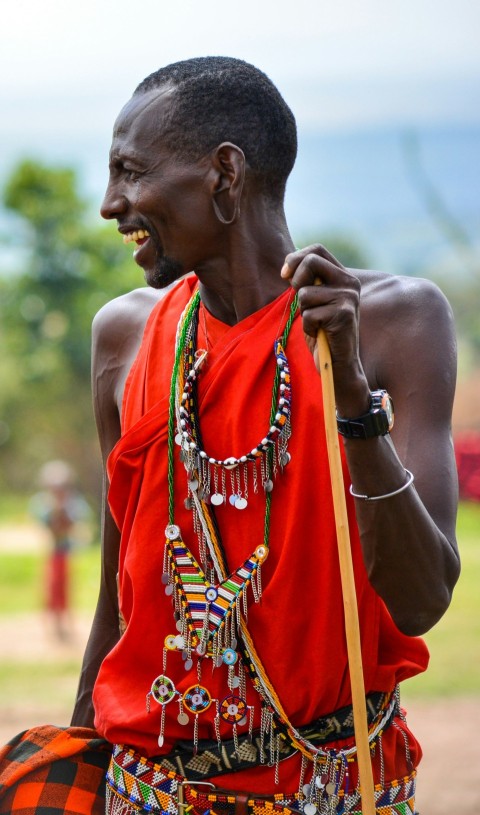 smiling man standing and facing his right side XNs