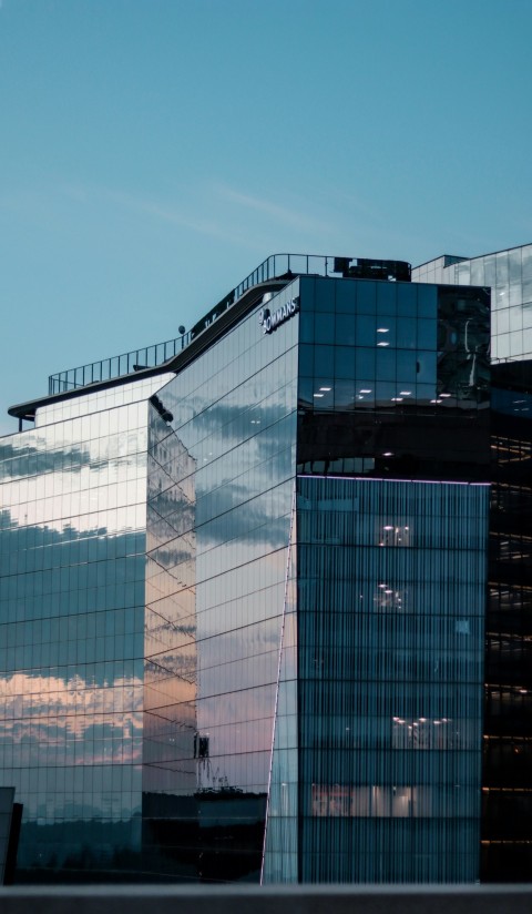 a tall building with a sky in the background Cpl6_g4Z