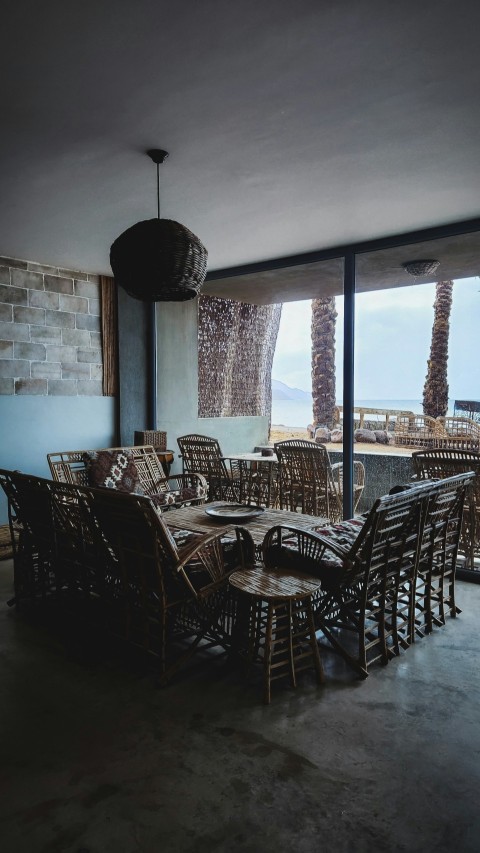 a dining room with a large table and chairs JzXJ