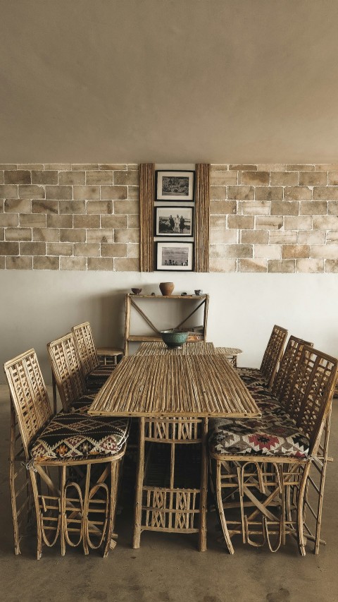 a dining room table and chairs made of bamboo