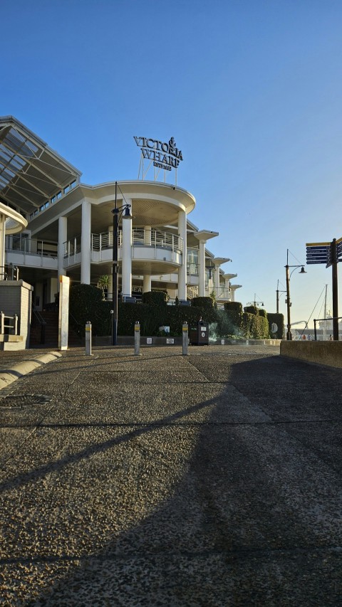 a large white building with a sign on top of it