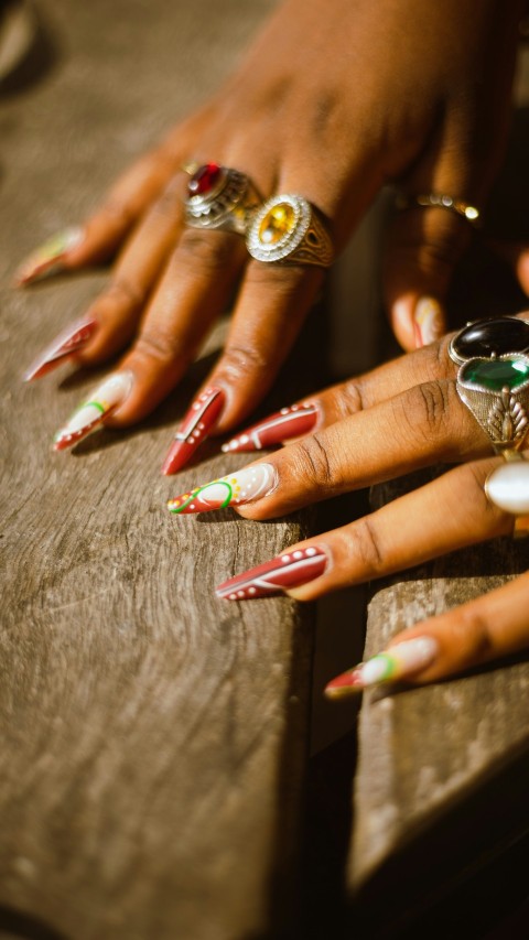 a close up of a persons hands with rings on them 51