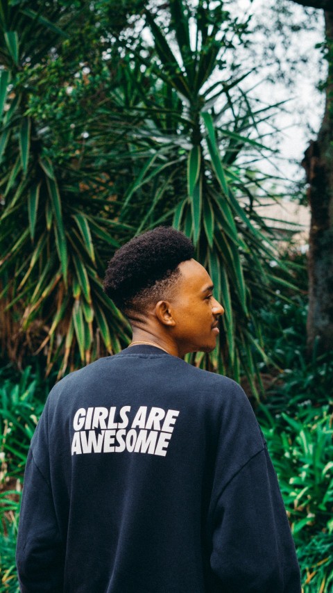 a man wearing a black sweatshirt that says girls are awesome C89aL3