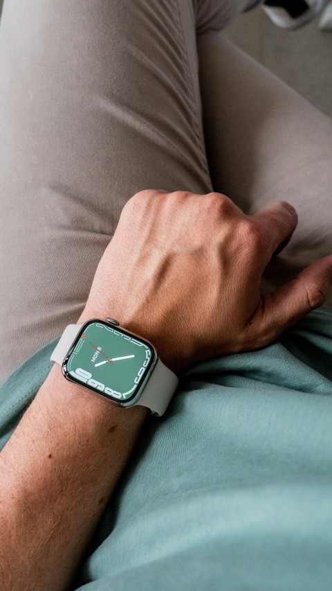 a close up of a person holding a smart watch