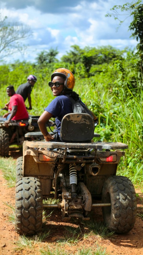 a man riding on the back of a four wheeler