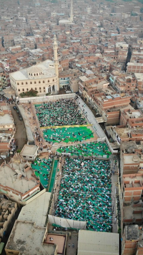 an aerial view of a large group of people in a city